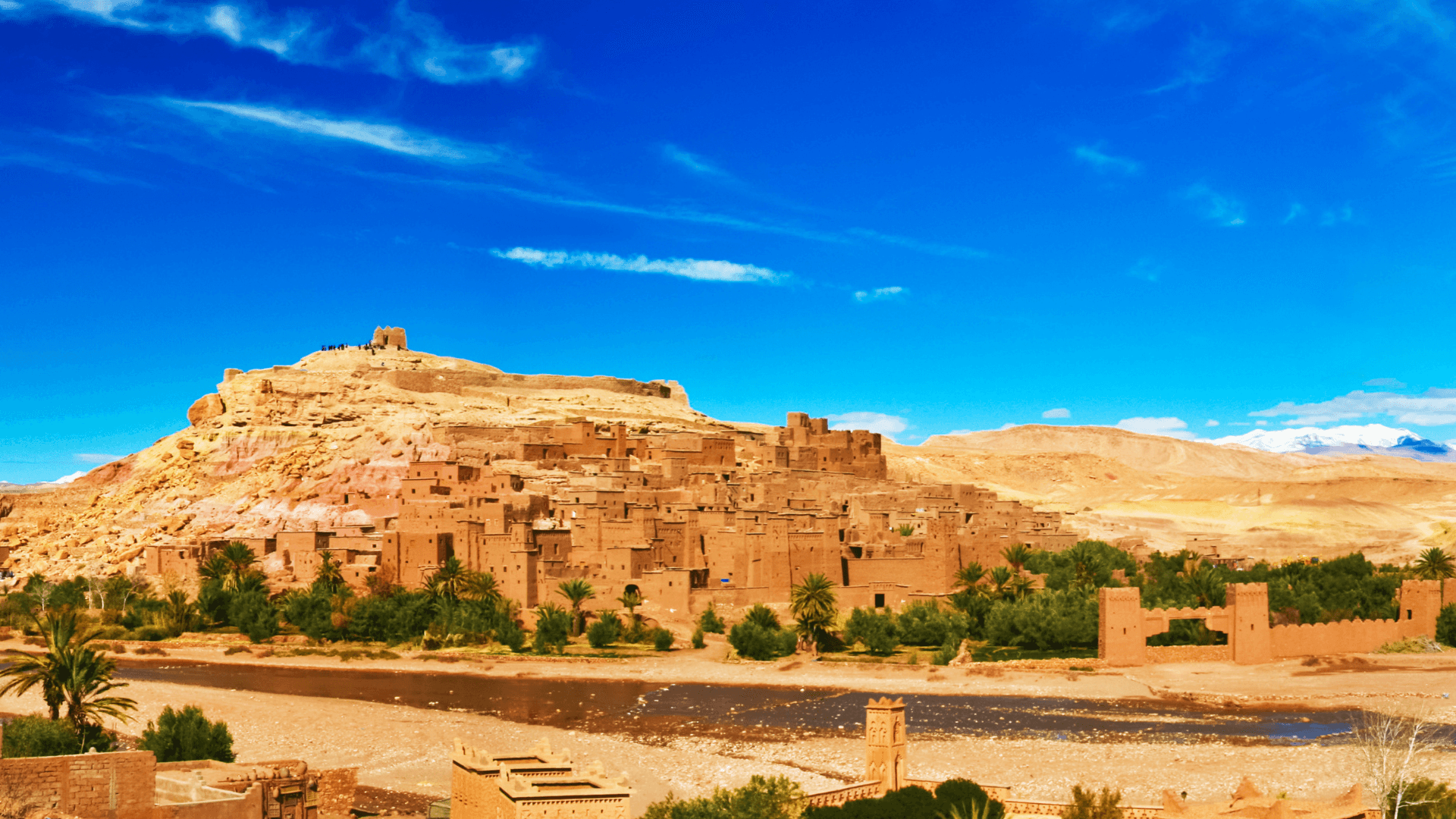 Explore the historic Ait Benhaddou, a fortified village along the former caravan route between the Sahara and Marrakech. This UNESCO World Heritage site has appeared in numerous films and offers a stunning example of Moroccan earthen clay architecture.