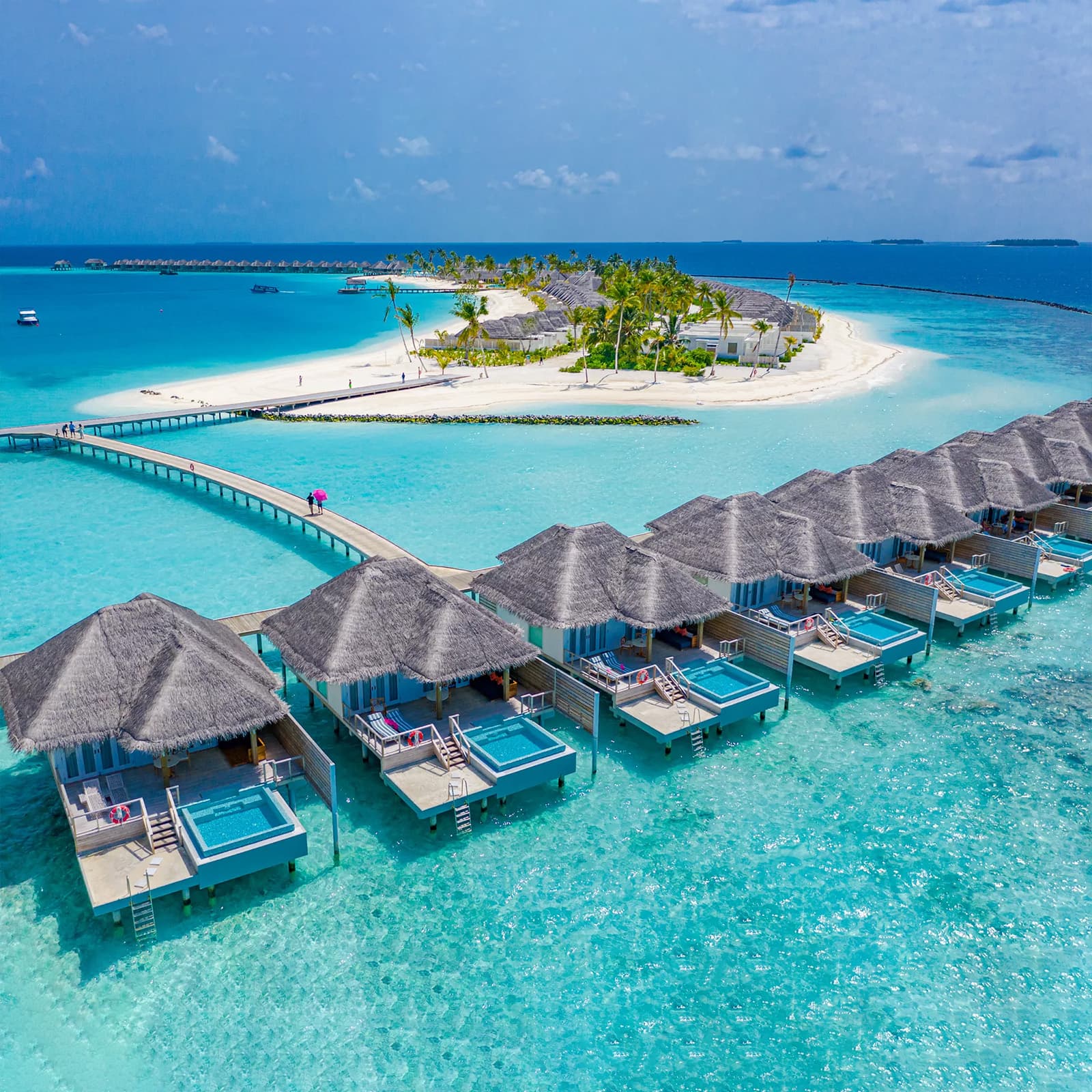 Stay in luxurious overwater villas with panoramic ocean views.