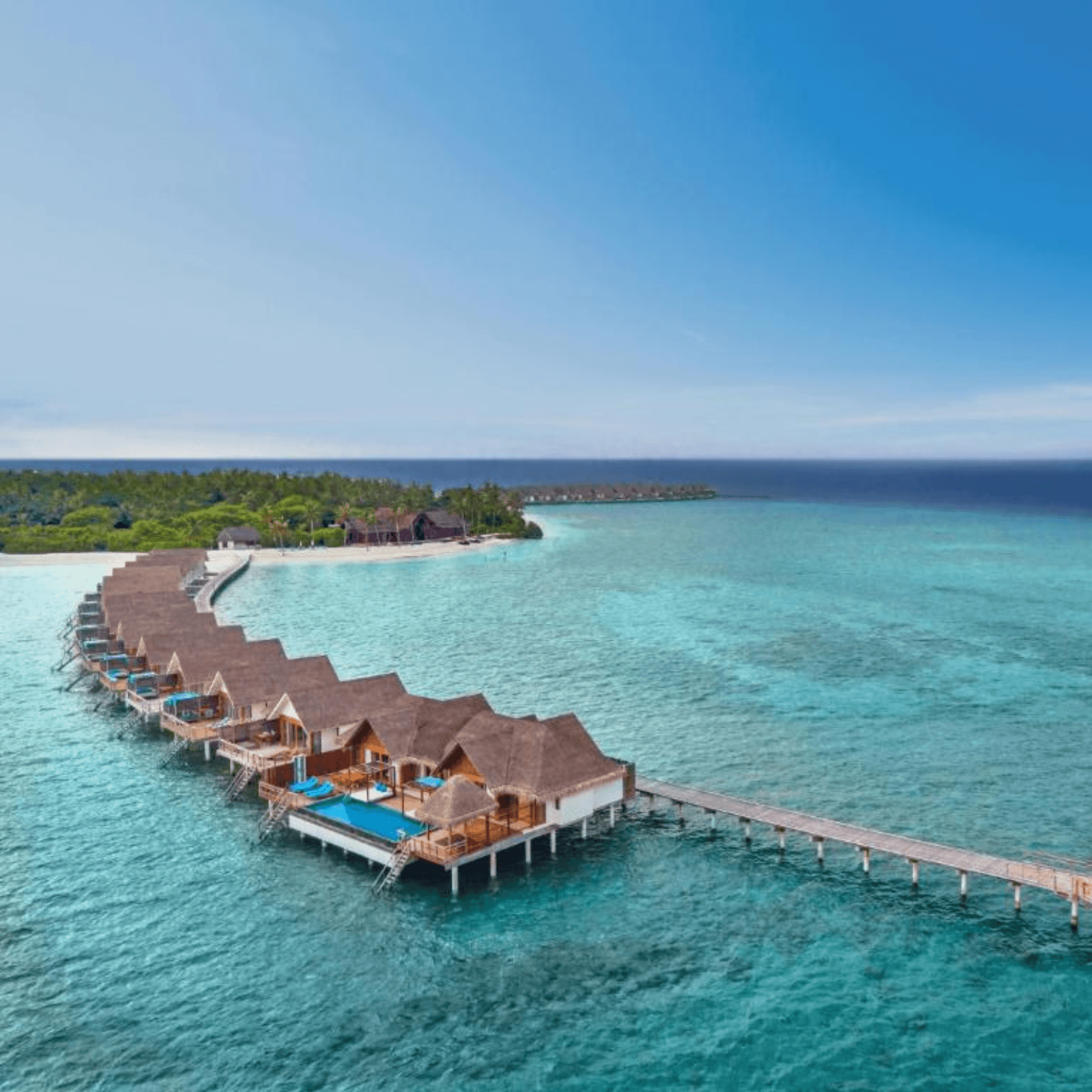 Stay in an overwater villa with direct lagoon access.